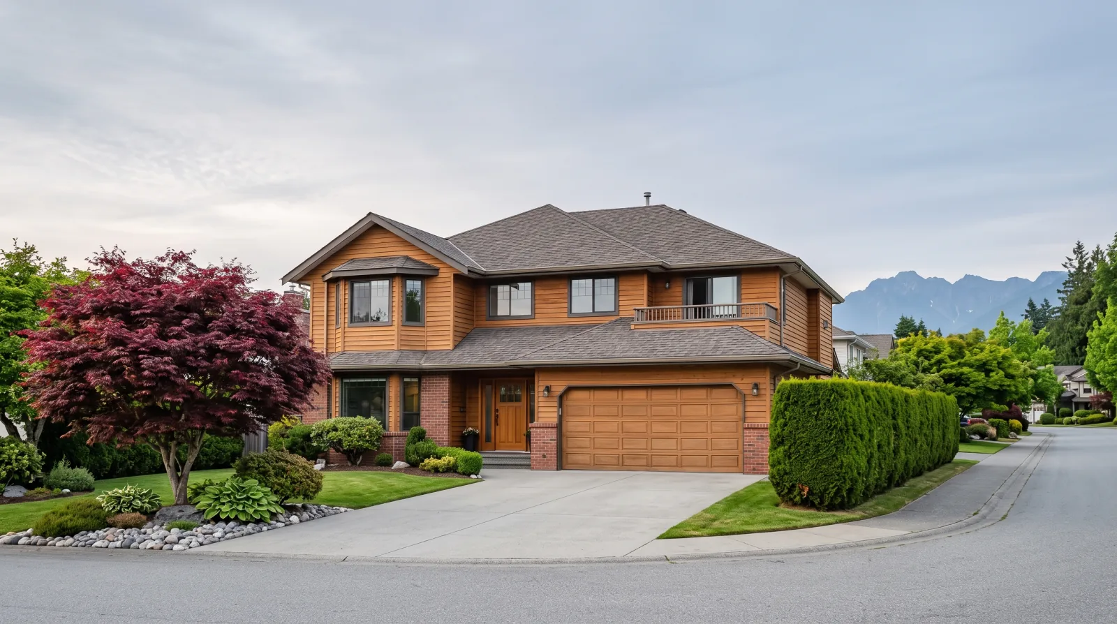 A two-storey family house from the 1980s on a quiet Fraser Valley street, with a maple tree and a cedar hedge in the front yard